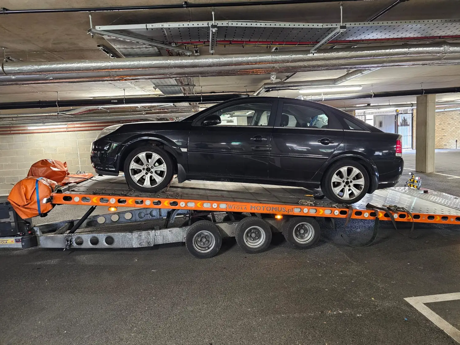 Vauxhall  recovered onto a flatbed truck in Chelmsford, Essex