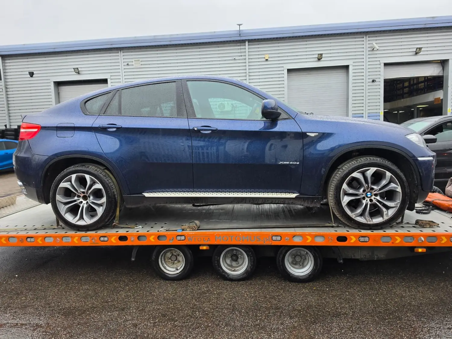 BMW X6 strapped down on a recovery truck in Upminster