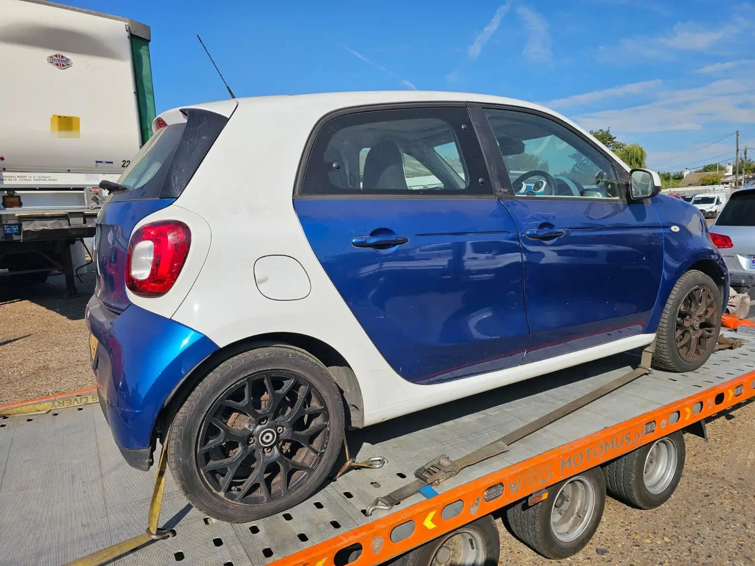 Smart Forfour loaded on a flatbed recovery truck in Stanford-le-Hope
